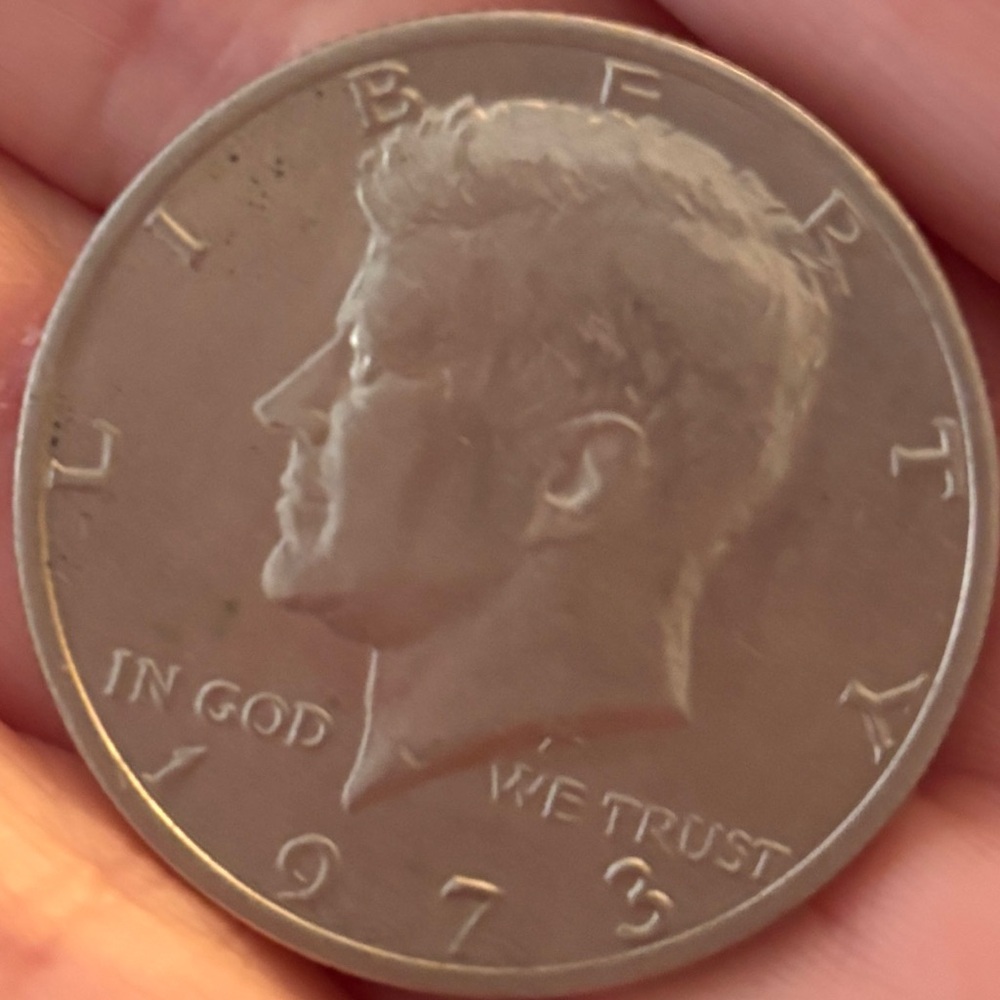 1973 US Half Dollar Coin with Kennedy on face side. In excellent condition